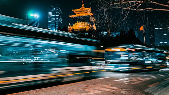 pngtree-vehicles-driving-back-and-forth-on-busy-road-in-city-night-image_862340
